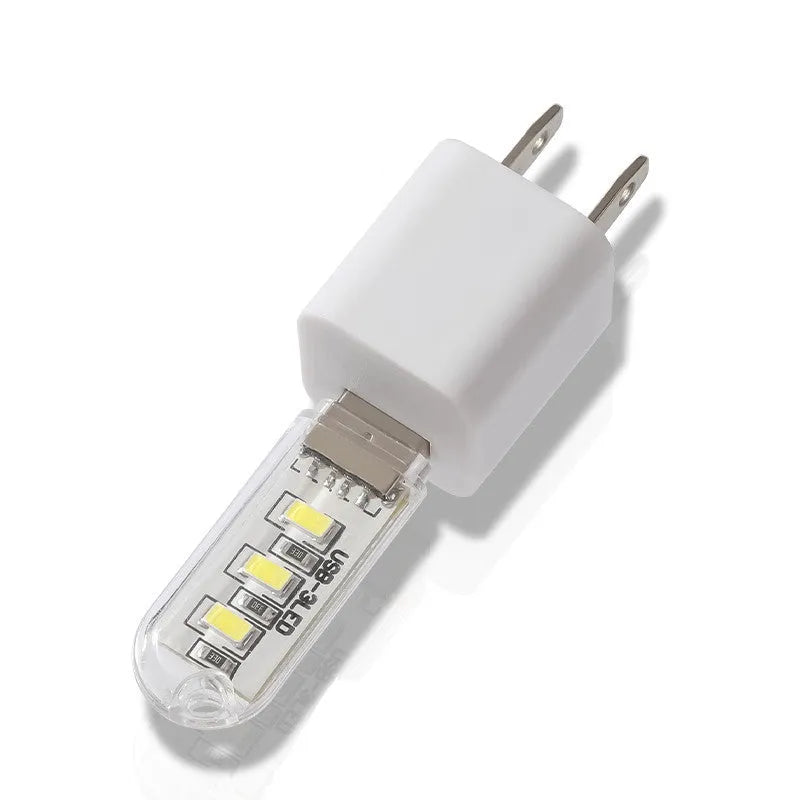 Small white USB-powered LED night light showing warm and white light options
