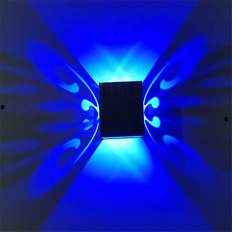 Modern aluminium butterfly-shaped LED wall lamp with remote control for seven colour options.