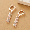 A pair of rectangular two-tone hollow stud earrings with an electroplated picture-style finish.