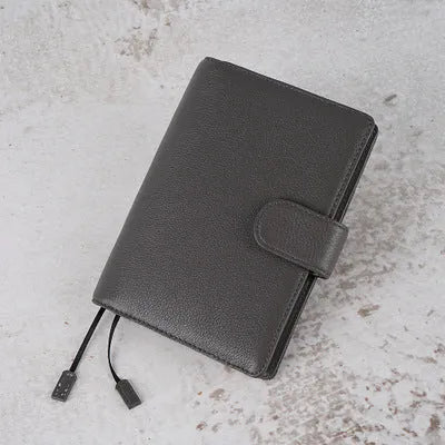 A6 loose-leaf diary with cowhide leather cover showing lychee pattern texture