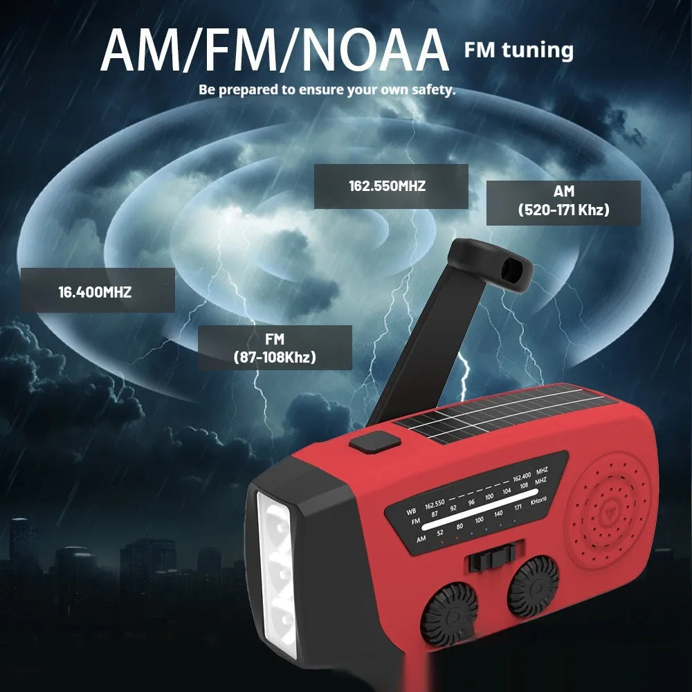 Red rechargeable hand-held emergency radio torch with wrist strap and USB charging port.