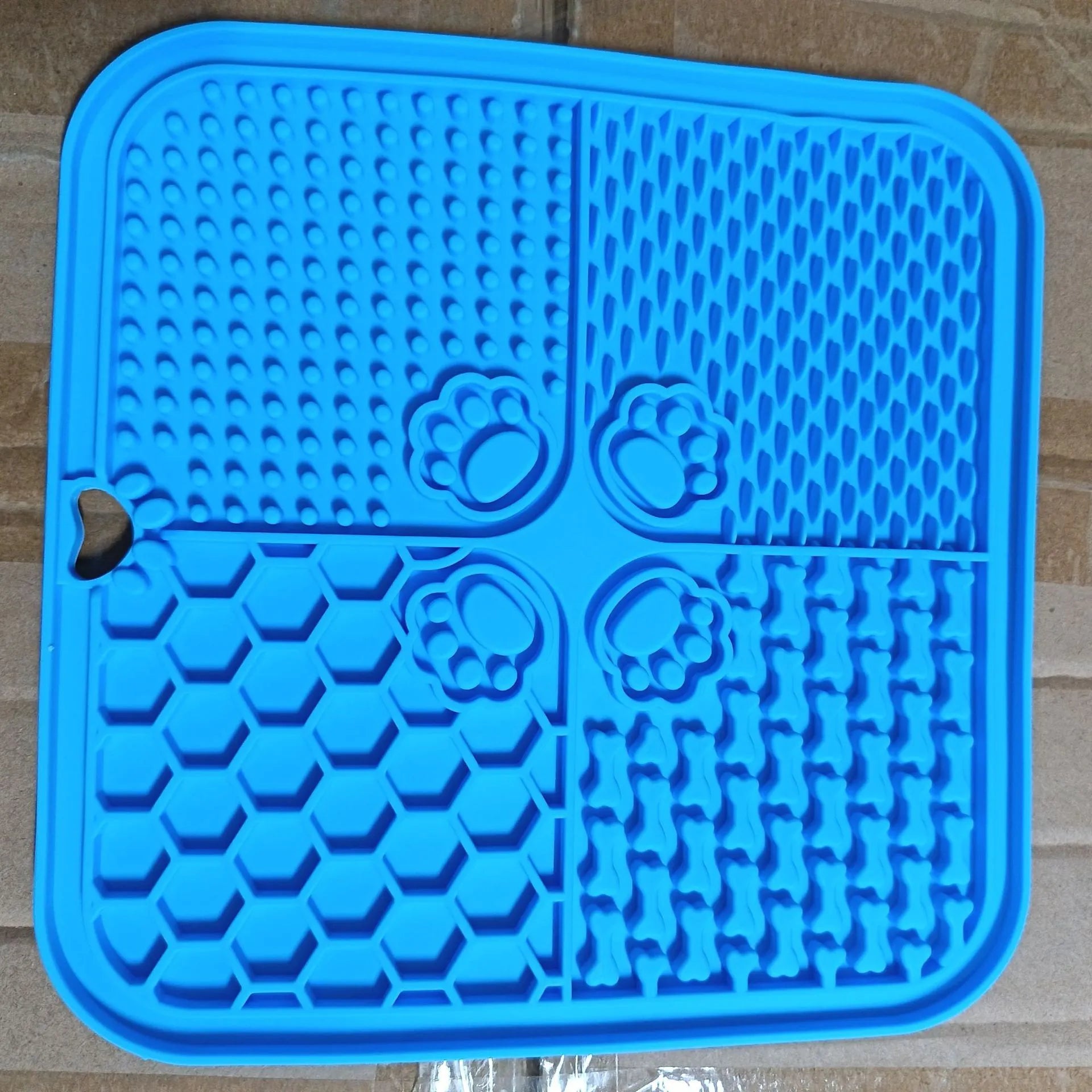 Silicone dog slow food mat in black with raised ridges to slow eating, anti-scatter design