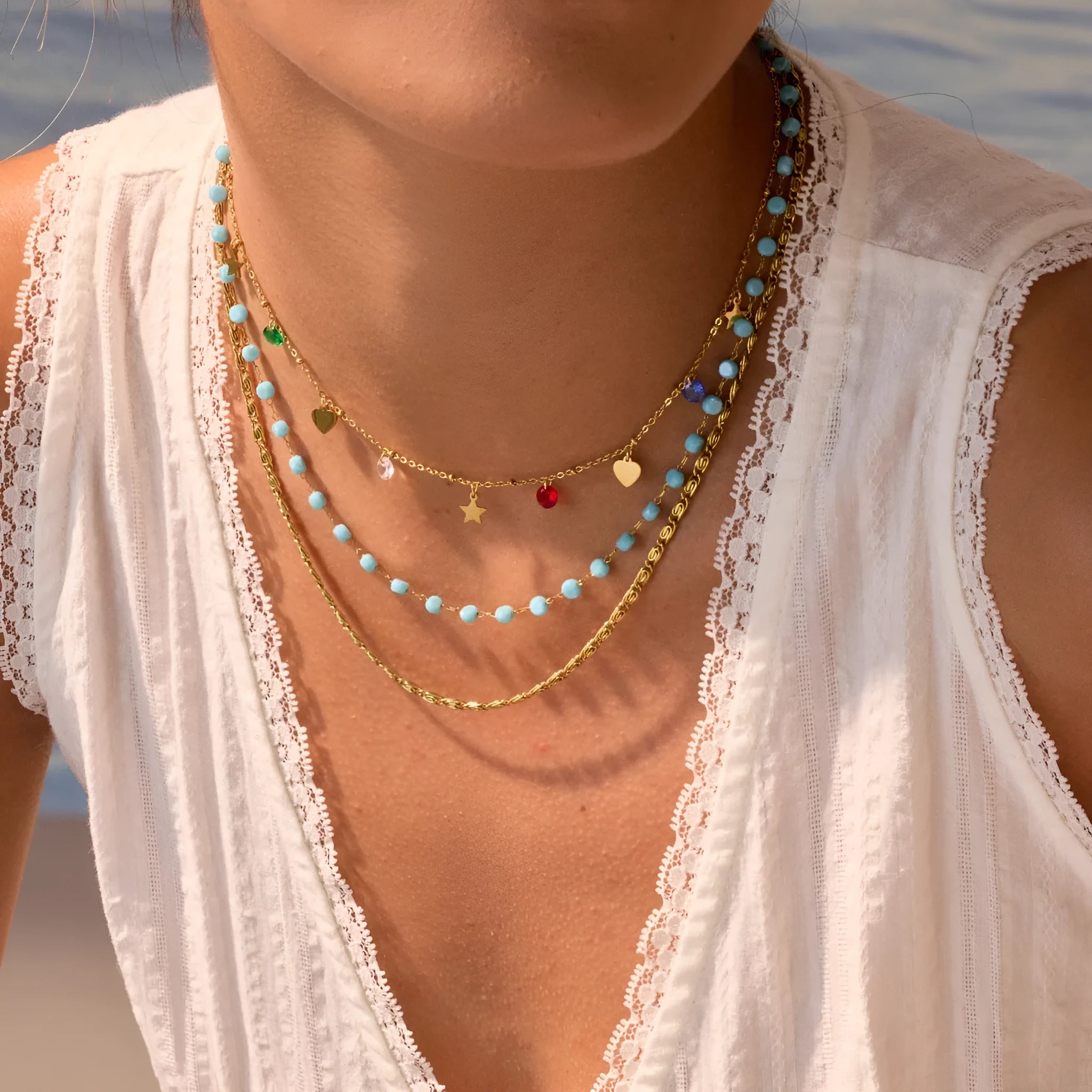 Stainless steel zircon necklace clavicle chain with beaded blue bracelet set geometric pendant on white background