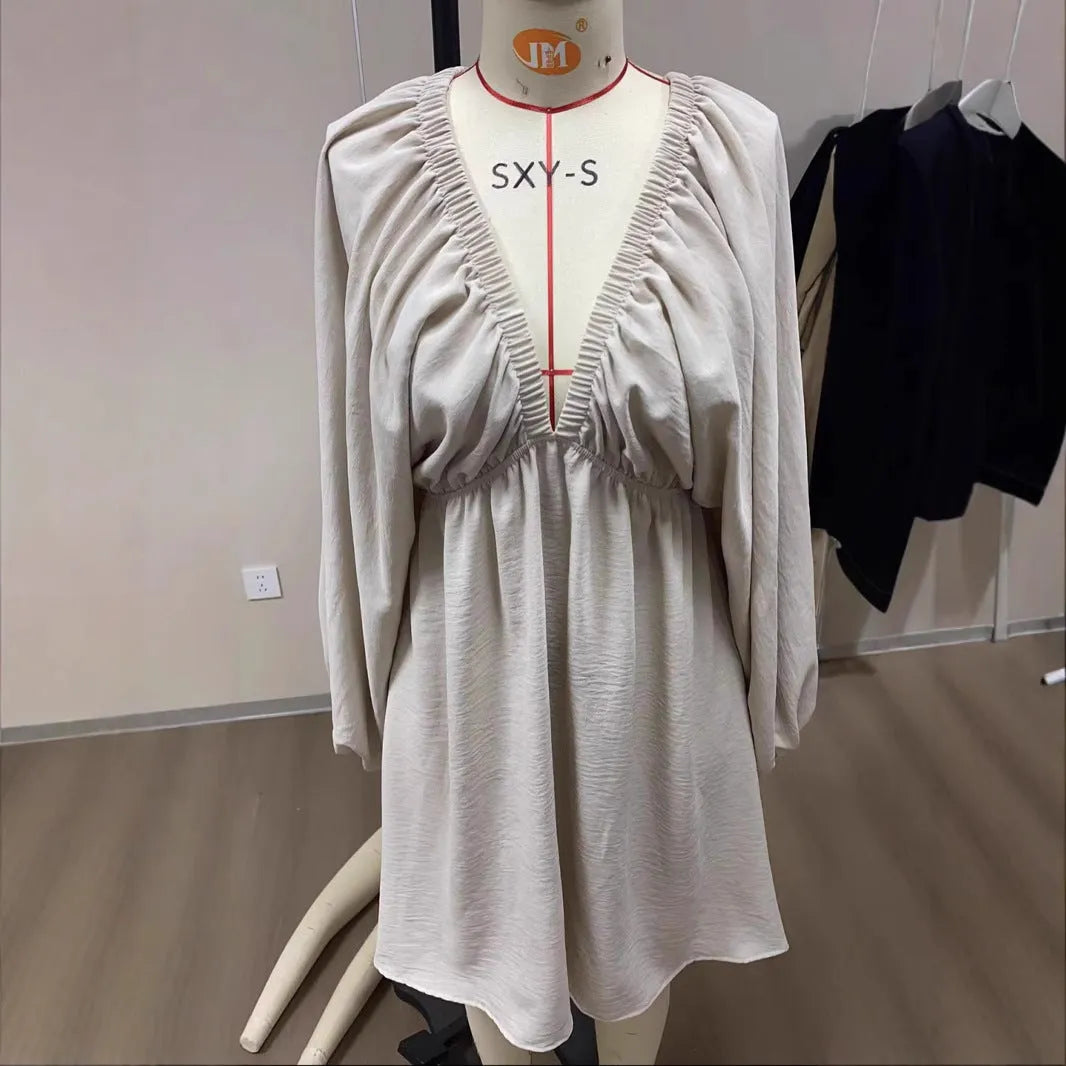 Women's V-neck long sleeve dress with puff sleeves and flounced swing skirt in solid colour