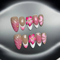 Set of white plastic almond-shaped nail tips with 3D raised lily and ice flower French manicure design.