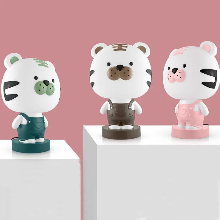 Cartoon style animal table lamp with plastic shade in random colour variation showing bear cattle rabbit or tiger design