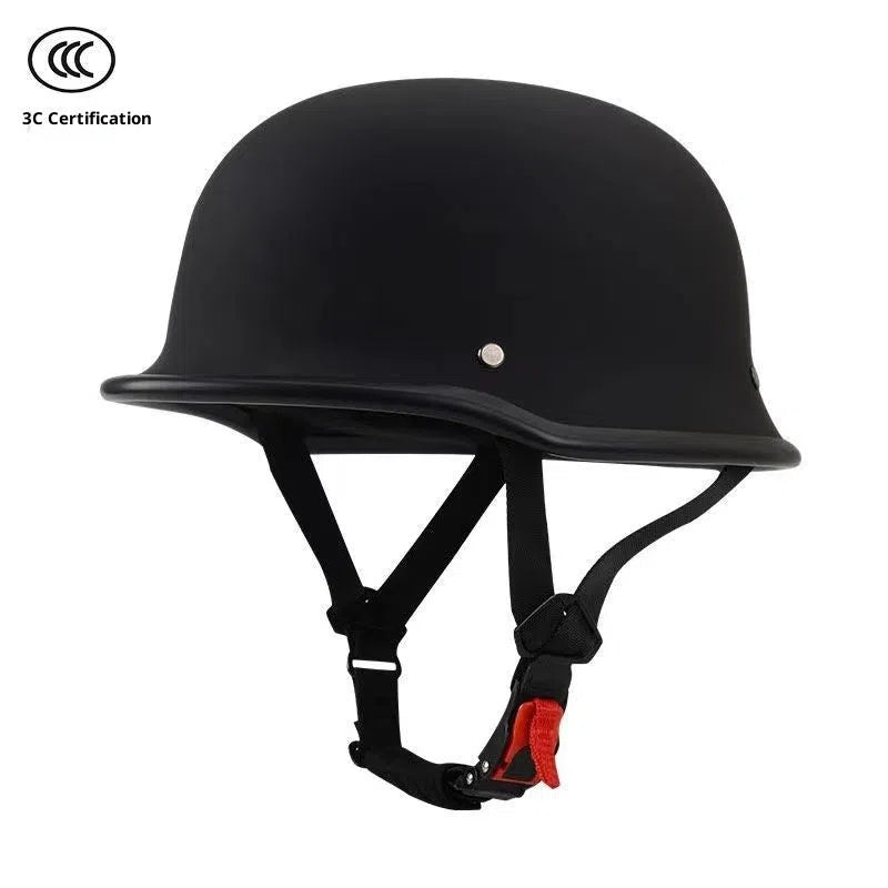 Men's retro motorcycle helmet in matte black ABS construction, side view on white background
