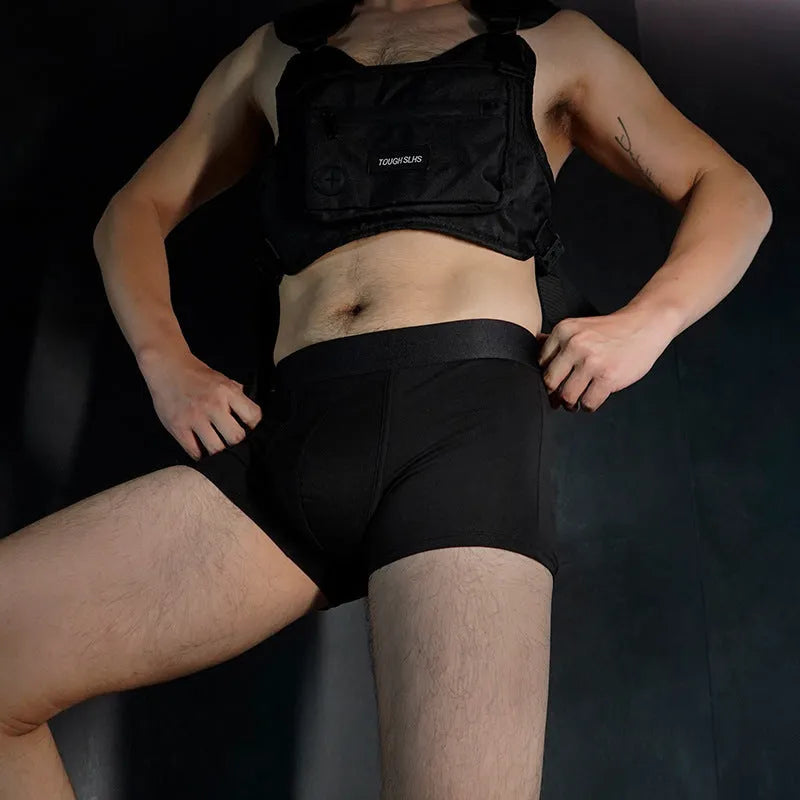 Men's solid colour cotton boxer shorts in black, shown in a loose fit style.