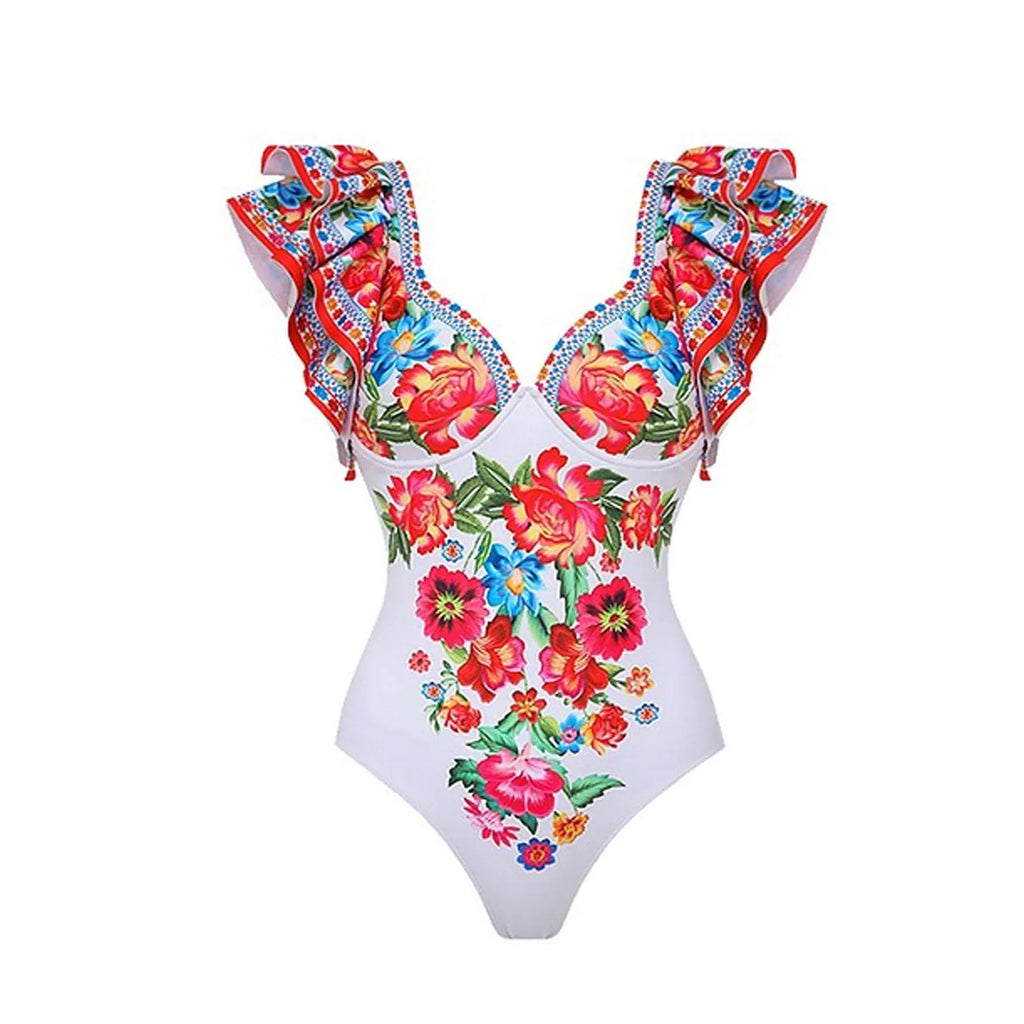 Women's floral printed one-piece polyester swimsuit on a hanger, showing skirted style.