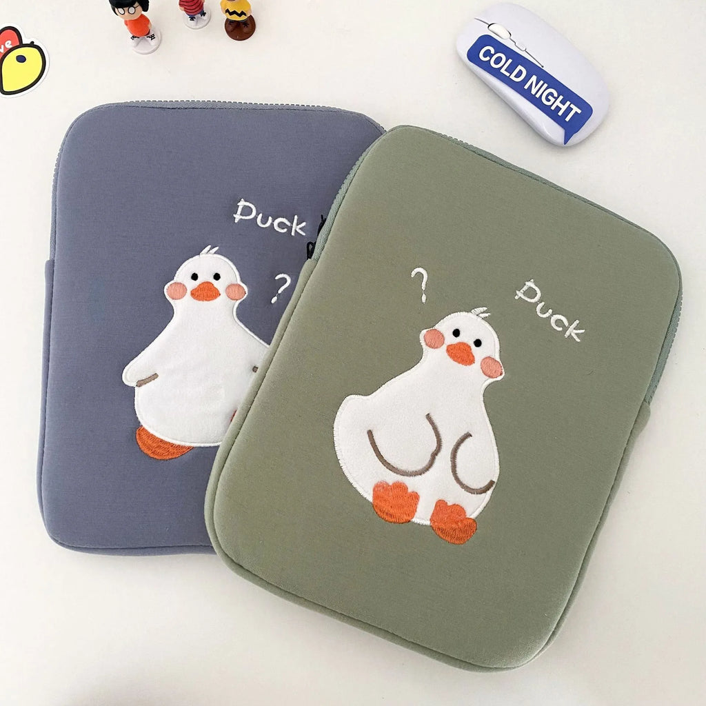 Blue cotton tablet case with embroidered cartoon duck design and a black zipper, shown open.