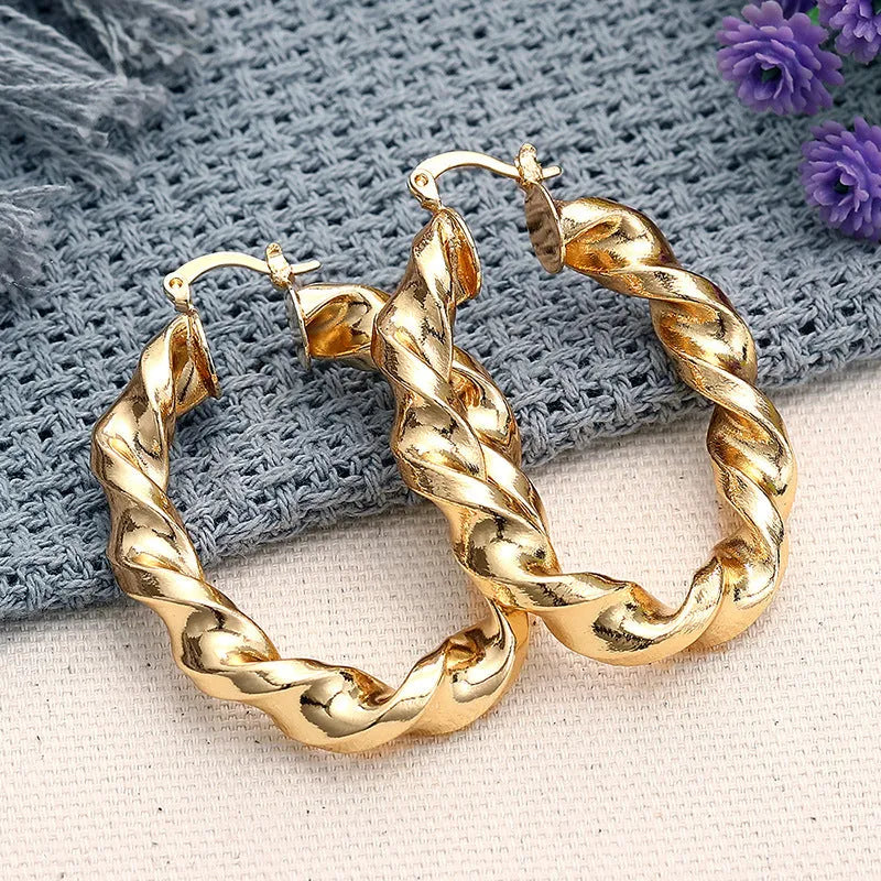 Women's geometric ear clip earrings with drop-shaped ring design in copper with electroplated finish