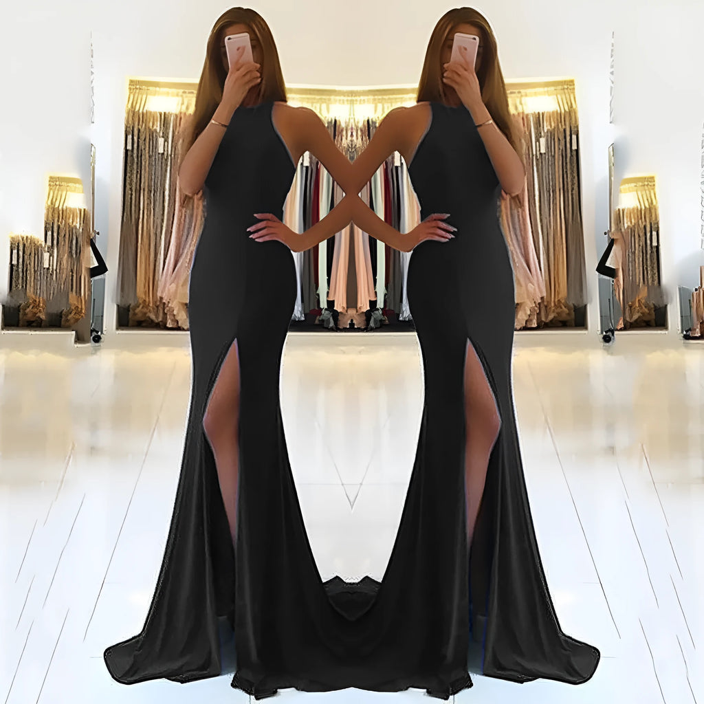 Red knitted long evening dress with high waist, large swing skirt, and hollow out detail on a mannequin.