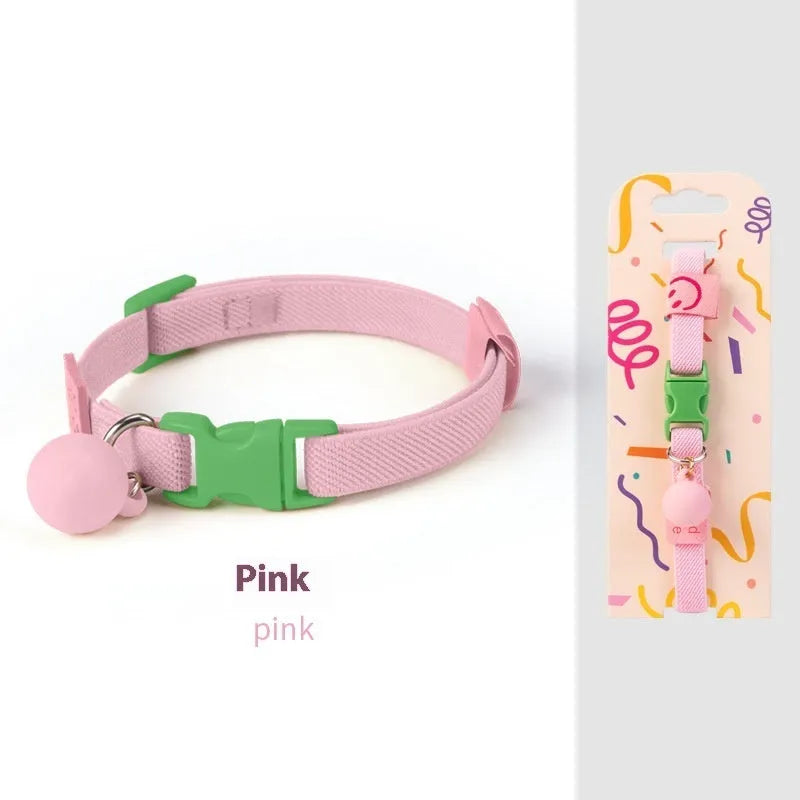 A stretchy yellow polyester dog collar for small breeds, shown adjusted to fit, with a metal D-ring.
