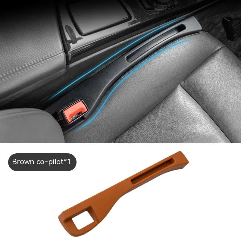 Black plastic car seat gap storage organiser box with handle between vehicle seats