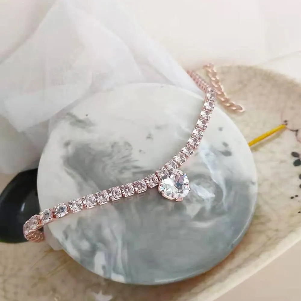 Heart-shaped rhinestone pet collar for dogs and cats in gold, with adjustment chain.