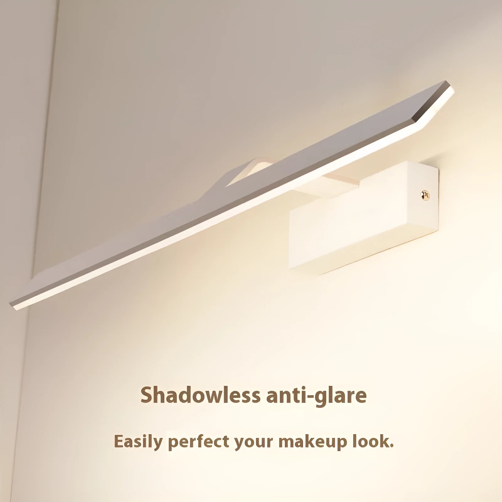 White LED illuminated bathroom mirror headlight mounted on wall, showing even light distribution across its length.