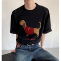 Men's gray cotton t-shirt with an embroidered cartoon sausage dog holding a blue towel.