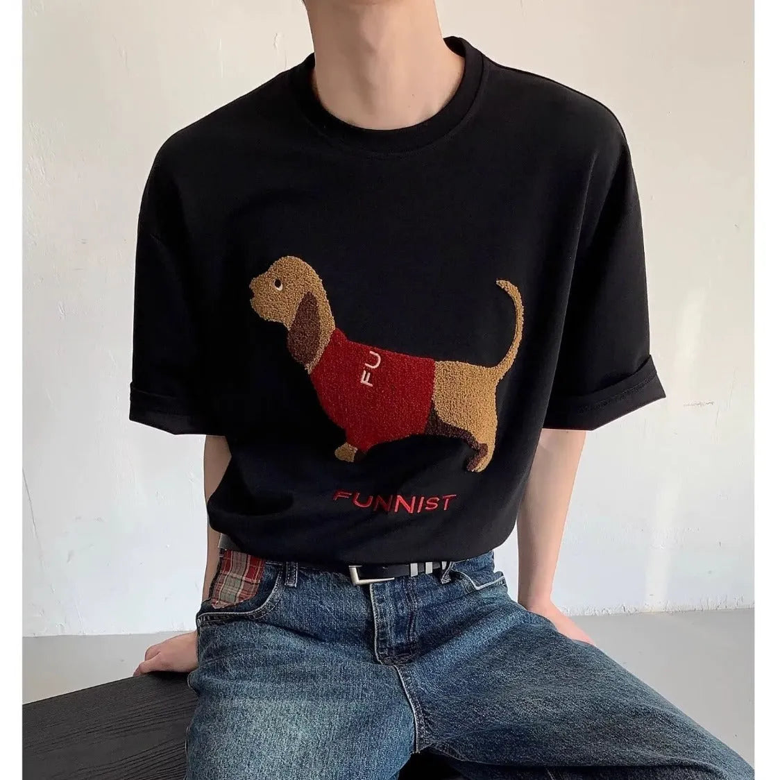 Men's gray cotton t-shirt with an embroidered cartoon sausage dog holding a blue towel.