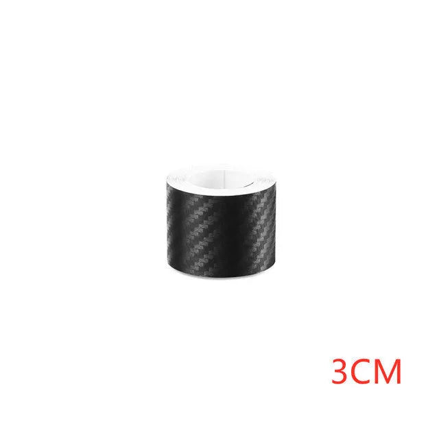 Matte carbon fibre pattern vinyl roll for car door sill protection, showing textured surface and roll format.