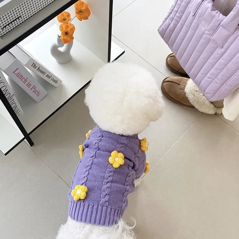Purple flower print knitted dog jumper shown on a small dog, demonstrating the floral pattern and fit.
