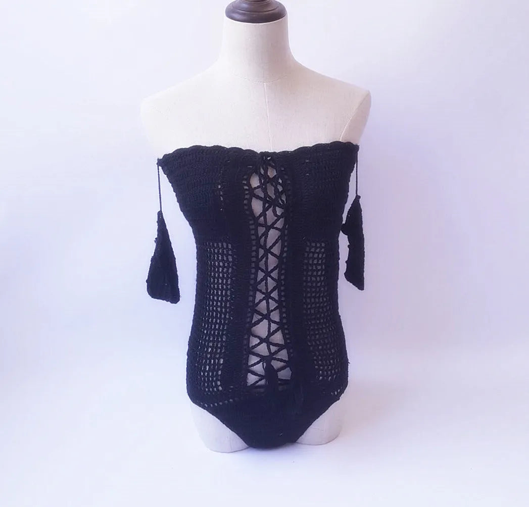 Off-shoulder one-piece swimsuit in polyester fabric on a mannequin.