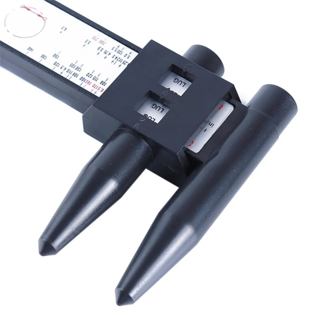 Plastic electronic digital caliper hole distance ruler on a white background.