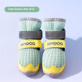 Pair of blue cartoon-style dog shoes with breathable PU uppers and anti-scald soles on a wooden surface.