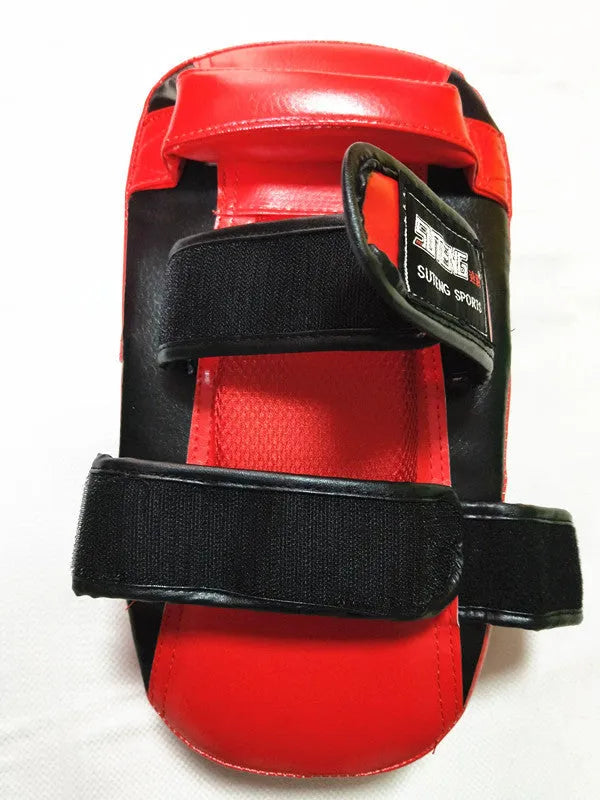 Black and red square hand-held martial arts training target pad with a buckle strap.