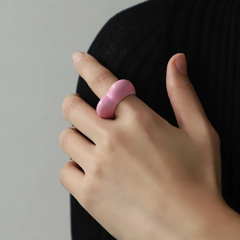 Heart-shaped zinc alloy enamel ring with three-dimensional colour detail in black, pink, purple, or red.