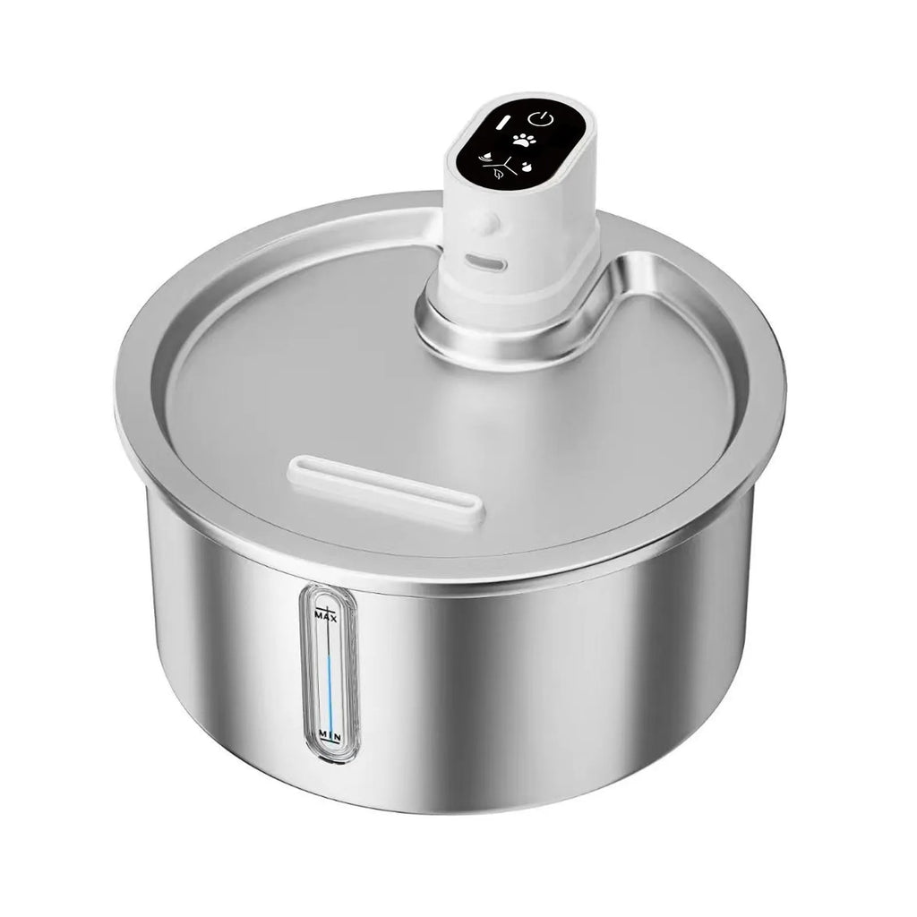 Stainless steel pet water fountain with a white heating base on a kitchen counter.