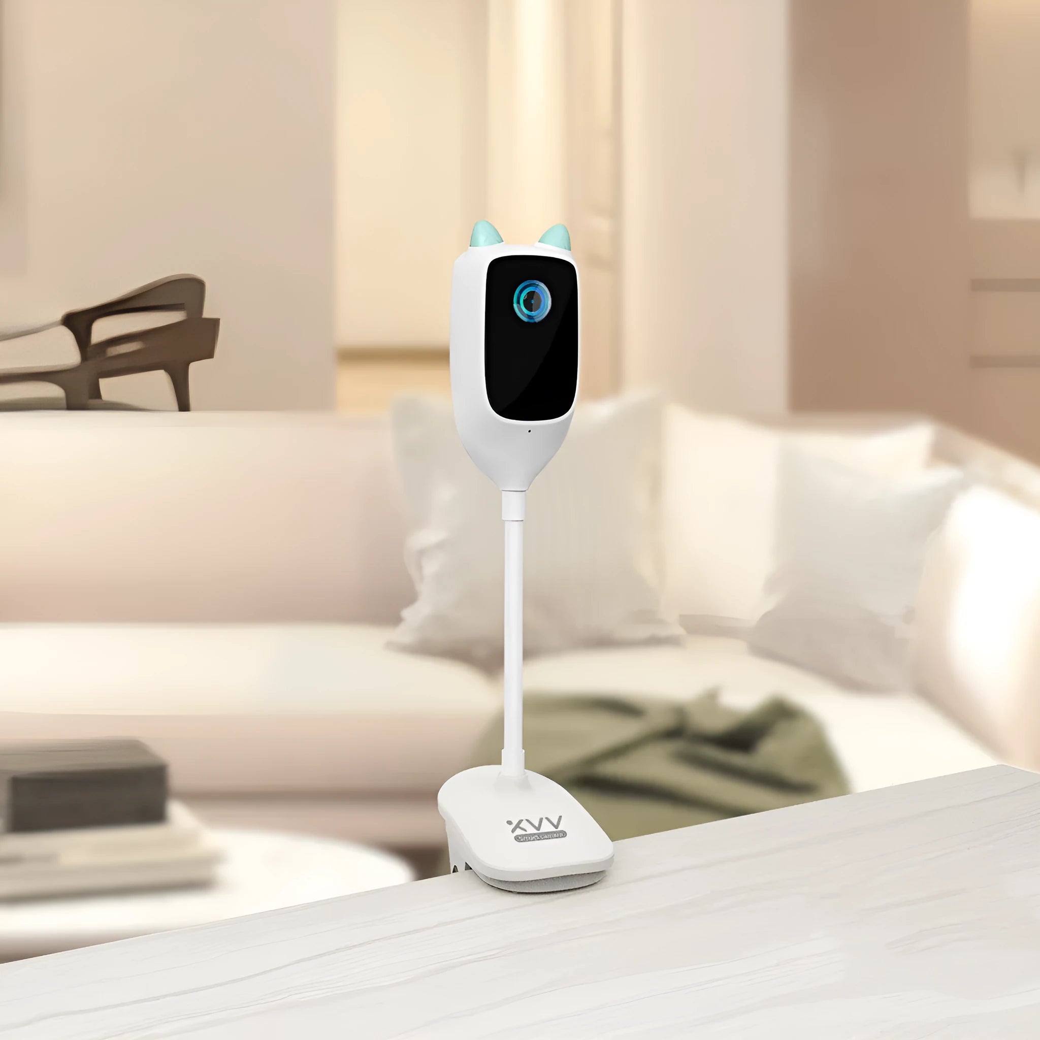 White smart baby monitor with 1080p HD night vision and 150 degree wide angle lens on a shelf