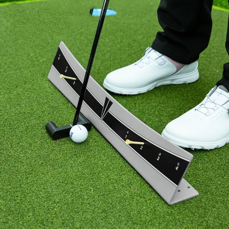 Golf putter with attached adjustable trajectory balance simulator, a PVC training aid for stroke feedback.
