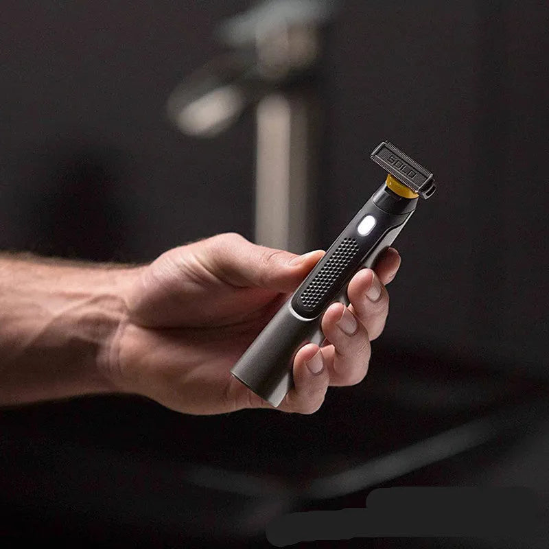 Black wireless rechargeable men's shaver with LED light on a compact stainless steel blade head