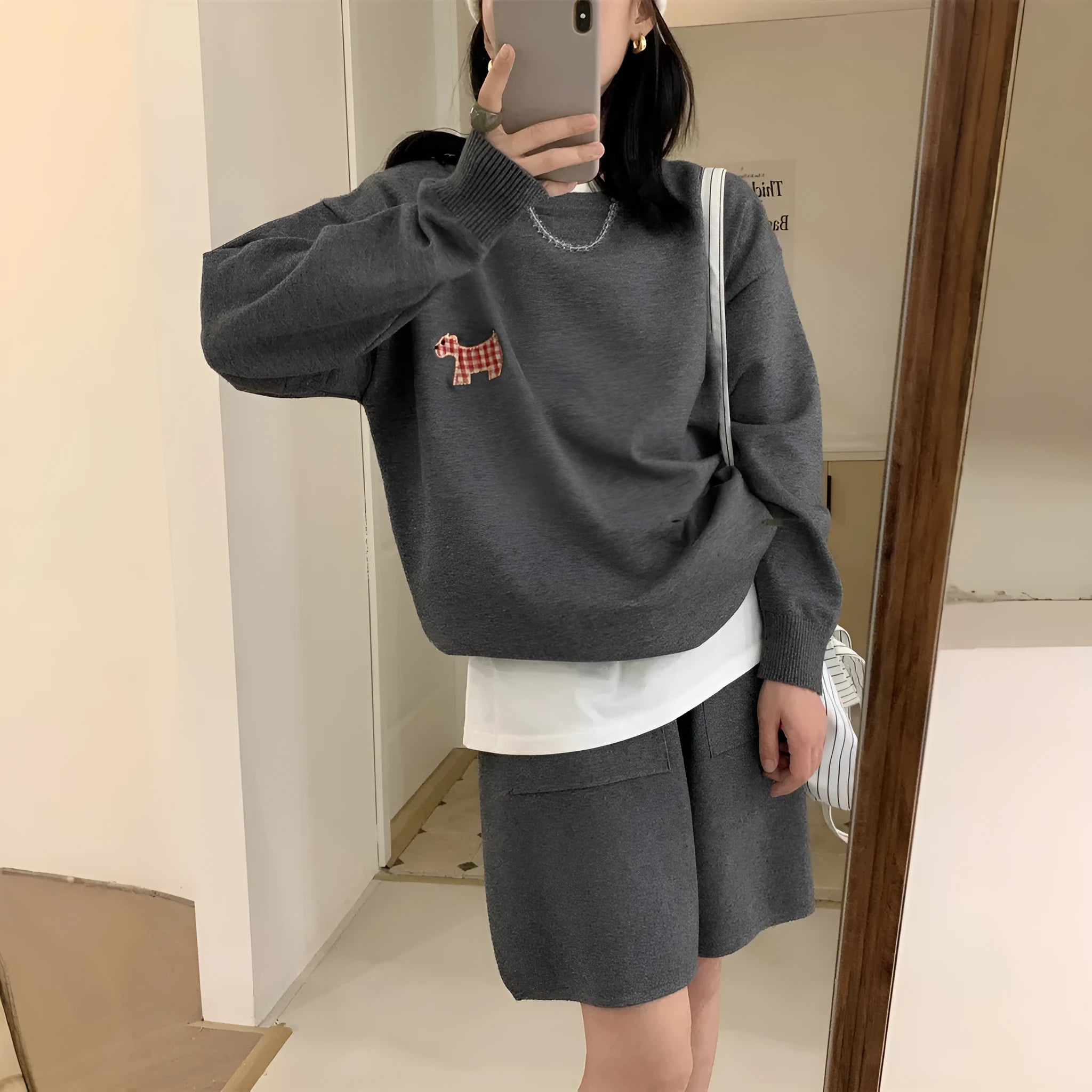 Women's milk blue knitted sweater and shorts suit with embroidered animal pattern.
