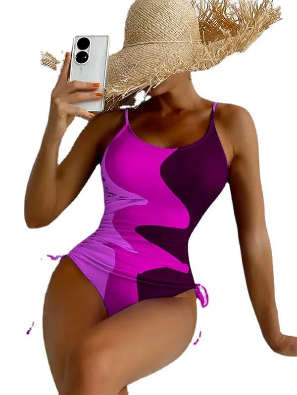 Women's sleeveless backless one-piece swimsuit in blue striped print
