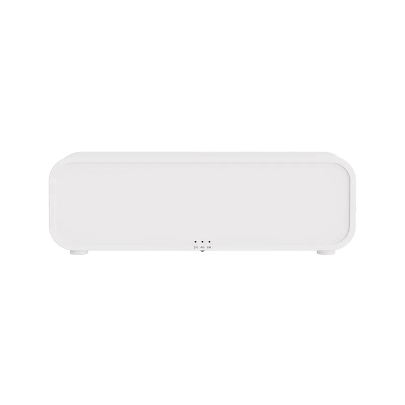 Black and white aromatherapy diffuser with flame LED effect and remote control on wooden surface