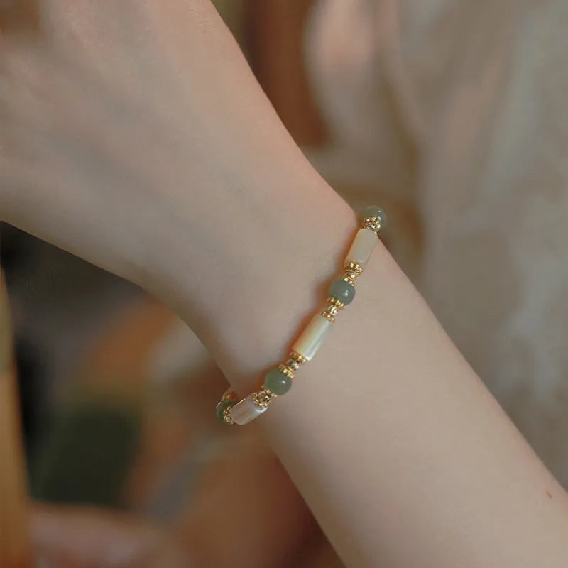 Natural Hetian jade white lip shell bracelet with geometric round beads in simple design