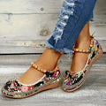 Women's black ethnic platform sandals with elastic band and cloth upper on a plus-size foot.