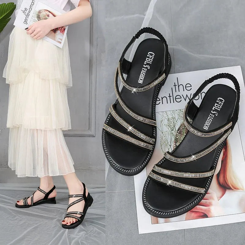 Women's silver Korean-style flat sandals with rhinestone elastic strap and round toe.
