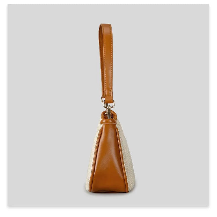 Khaki coloured hand-woven straw selenodon crossbody bag with a single shoulder strap