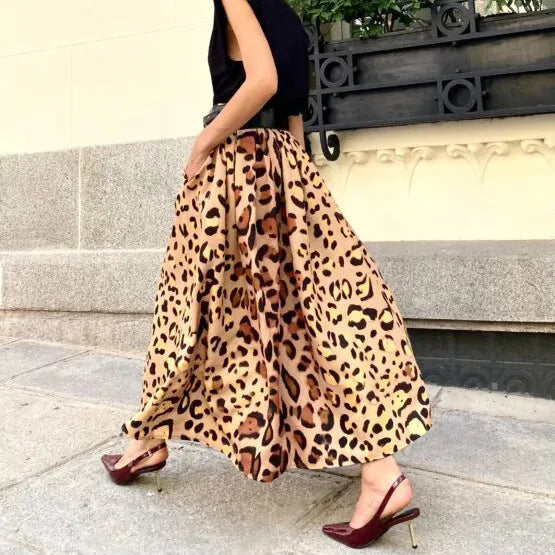 Brown leopard print women's A-line long skirt with a flared big hem, shown on a model.