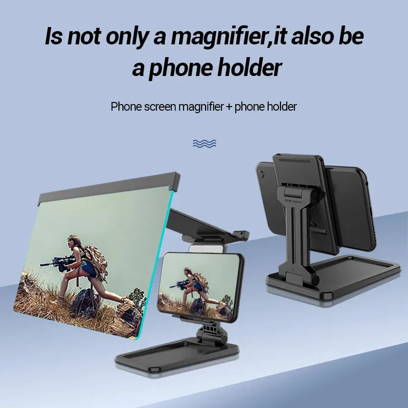 Black folding mobile phone screen magnifier and detachable phone holder on a desk.