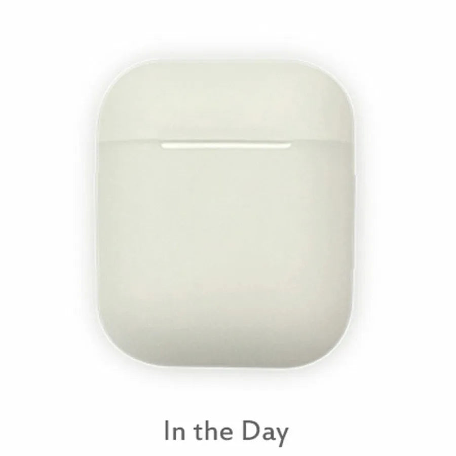 Luminous blue flip-top silicone protective case for Apple AirPods on a dark surface
