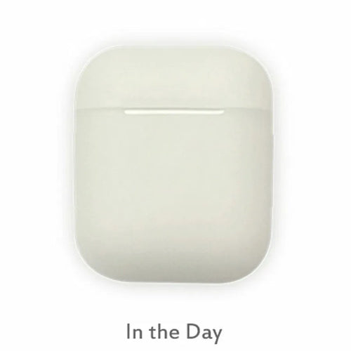 Luminous blue flip-top silicone protective case for Apple AirPods on a dark surface
