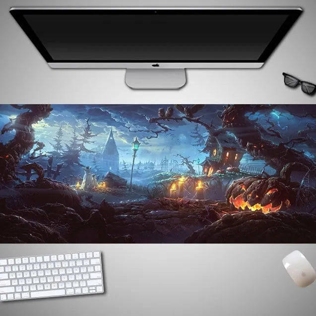 Large Halloween patterned gaming mouse pad on a desk showing non-slip rubber base and extra-long design.