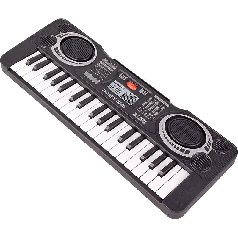 Children's 37-key electronic organ toy in black plastic on a table