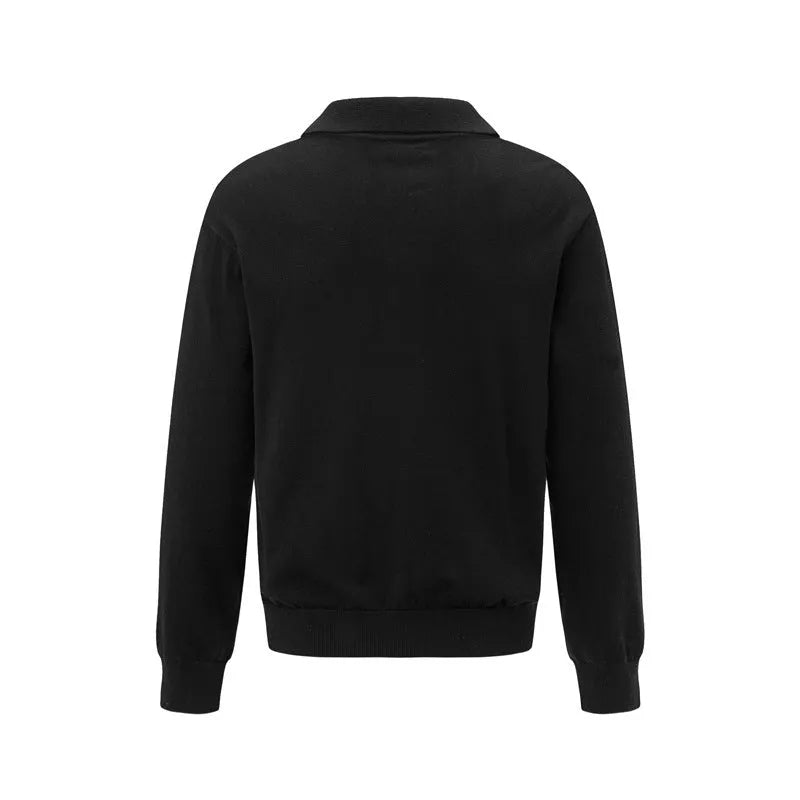Man wearing a loose fit black acrylic pullover sweater for casual wear.