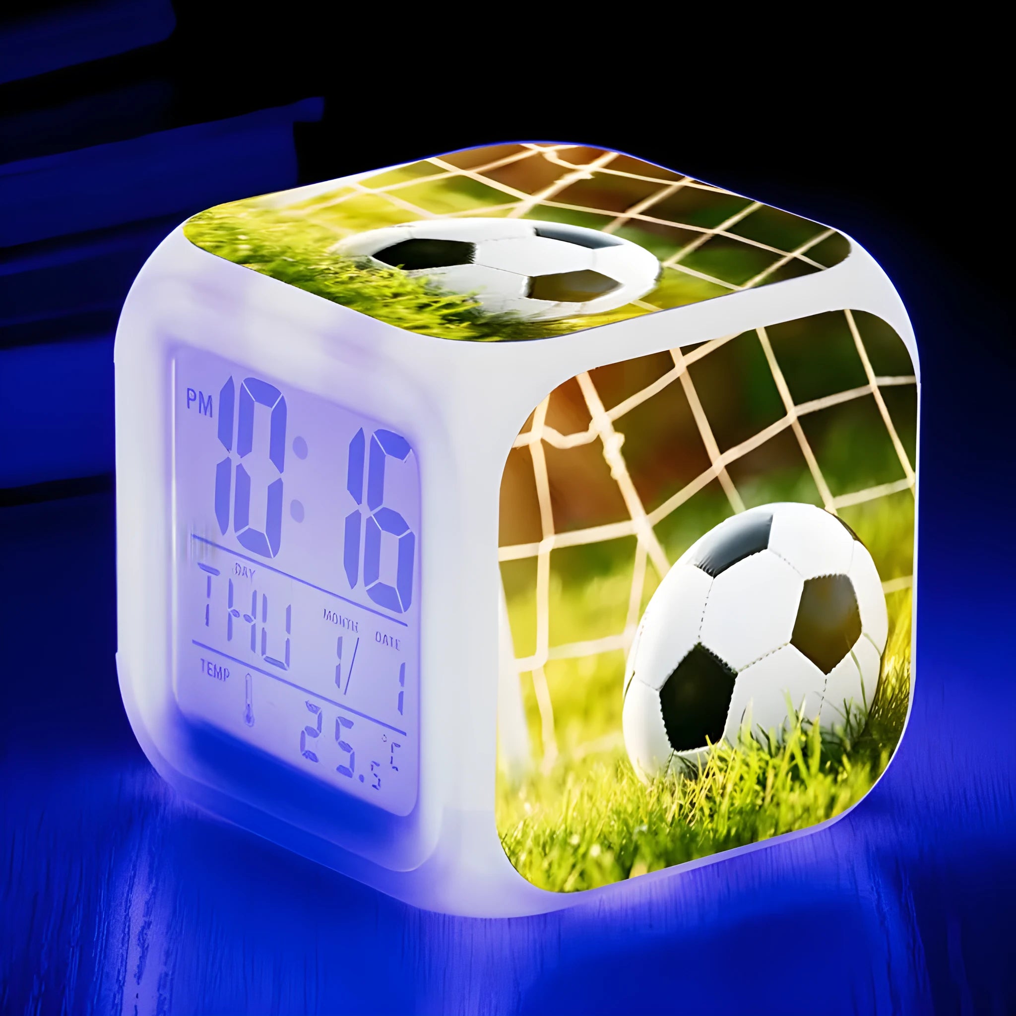 Square cartoon football pattern mute alarm clock for students and children on a desk.