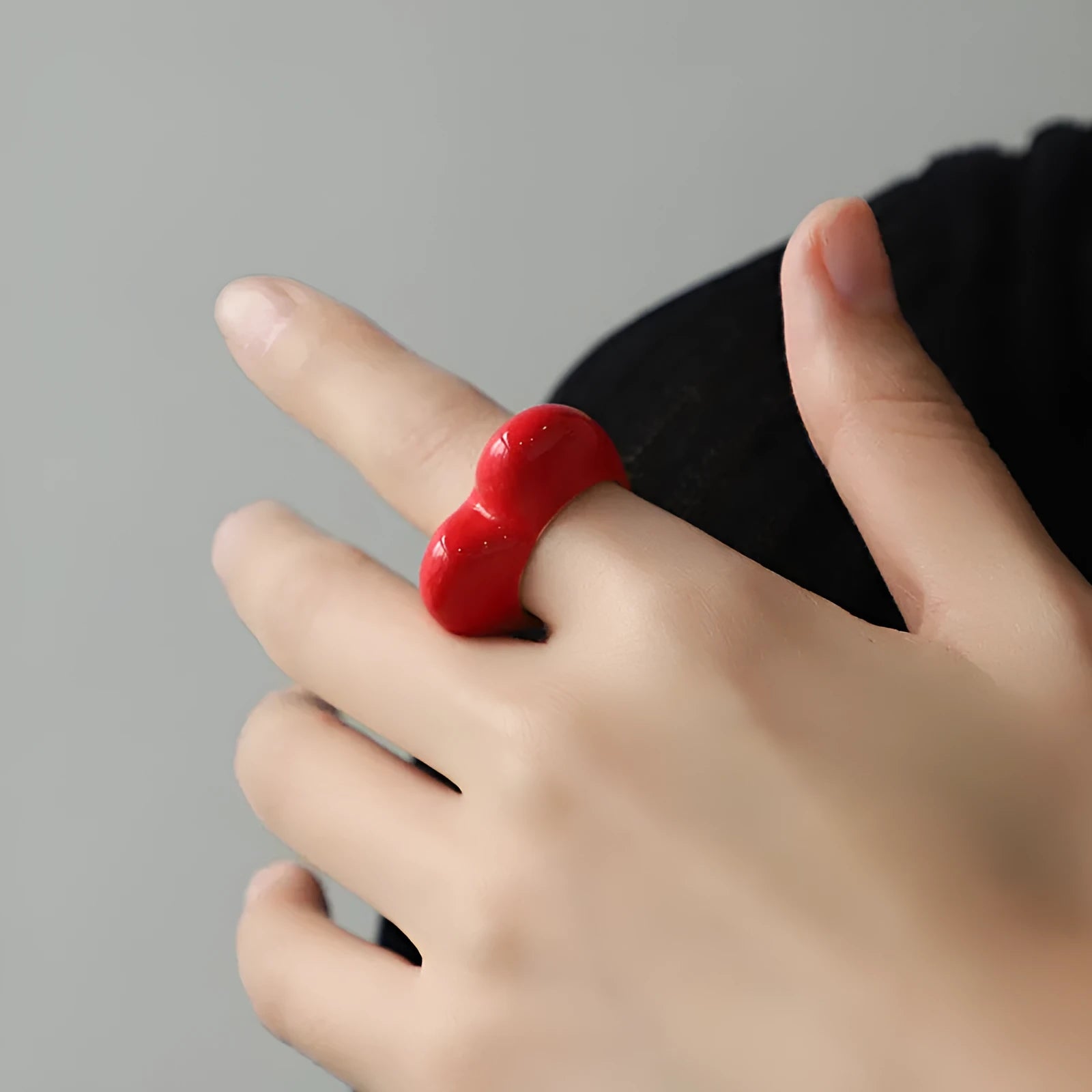 Heart-shaped zinc alloy enamel ring with three-dimensional colour detail in black, pink, purple, or red.