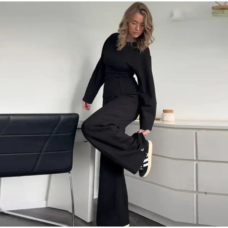 Women's black polar fleece suit set with pleated long sleeve top and wide leg trousers